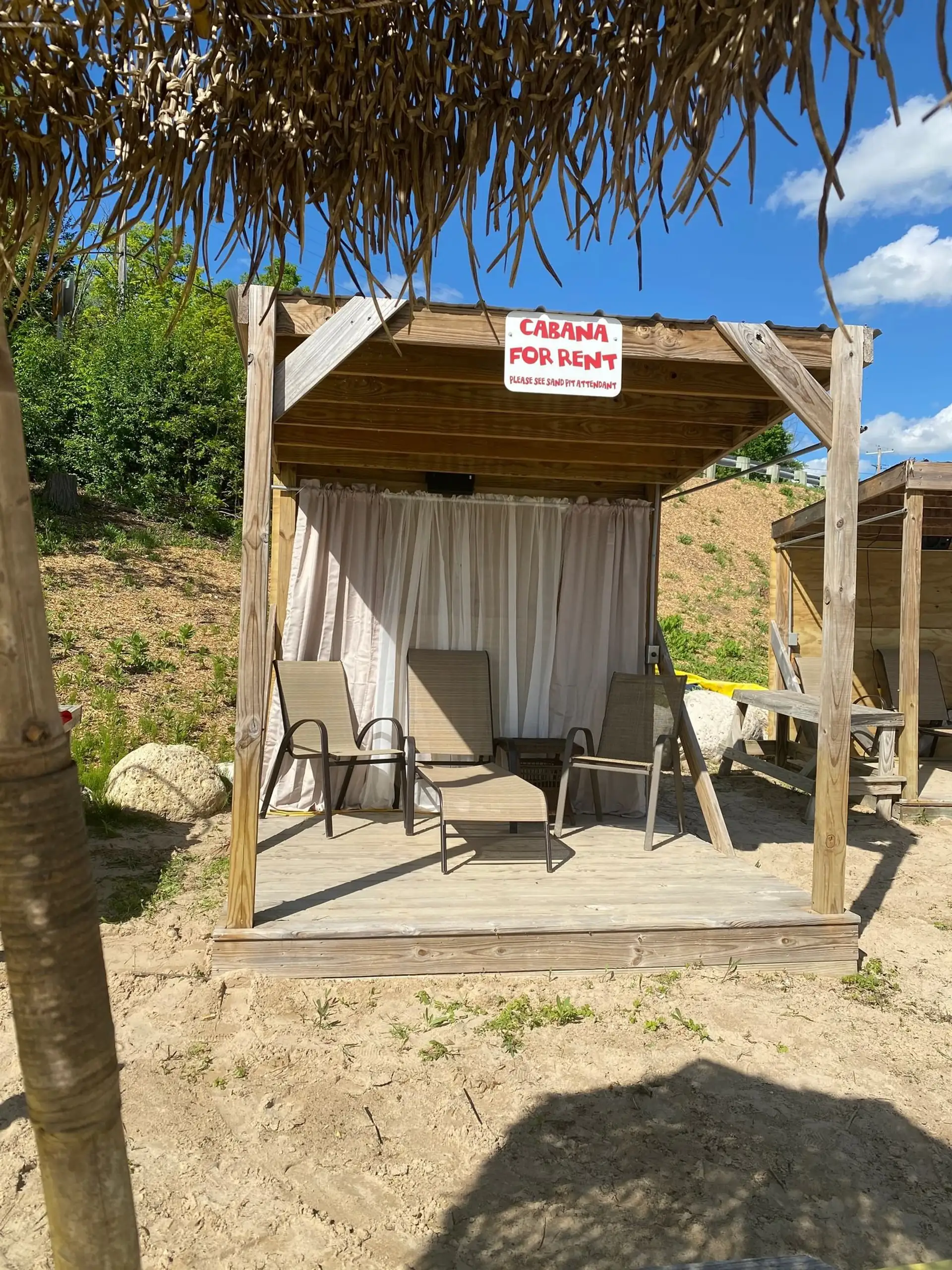 Thatched-roof cabana set up and ready to rent
