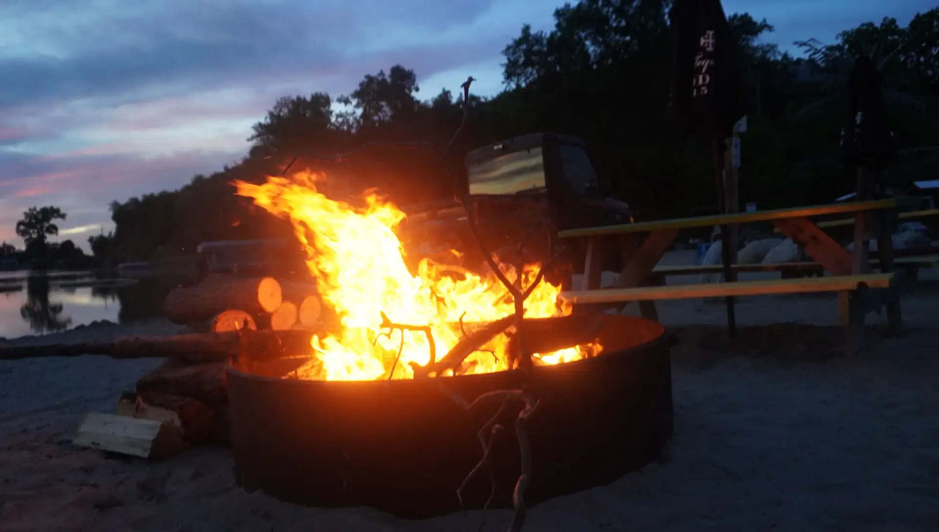 Flames in the beach fire pit after dark