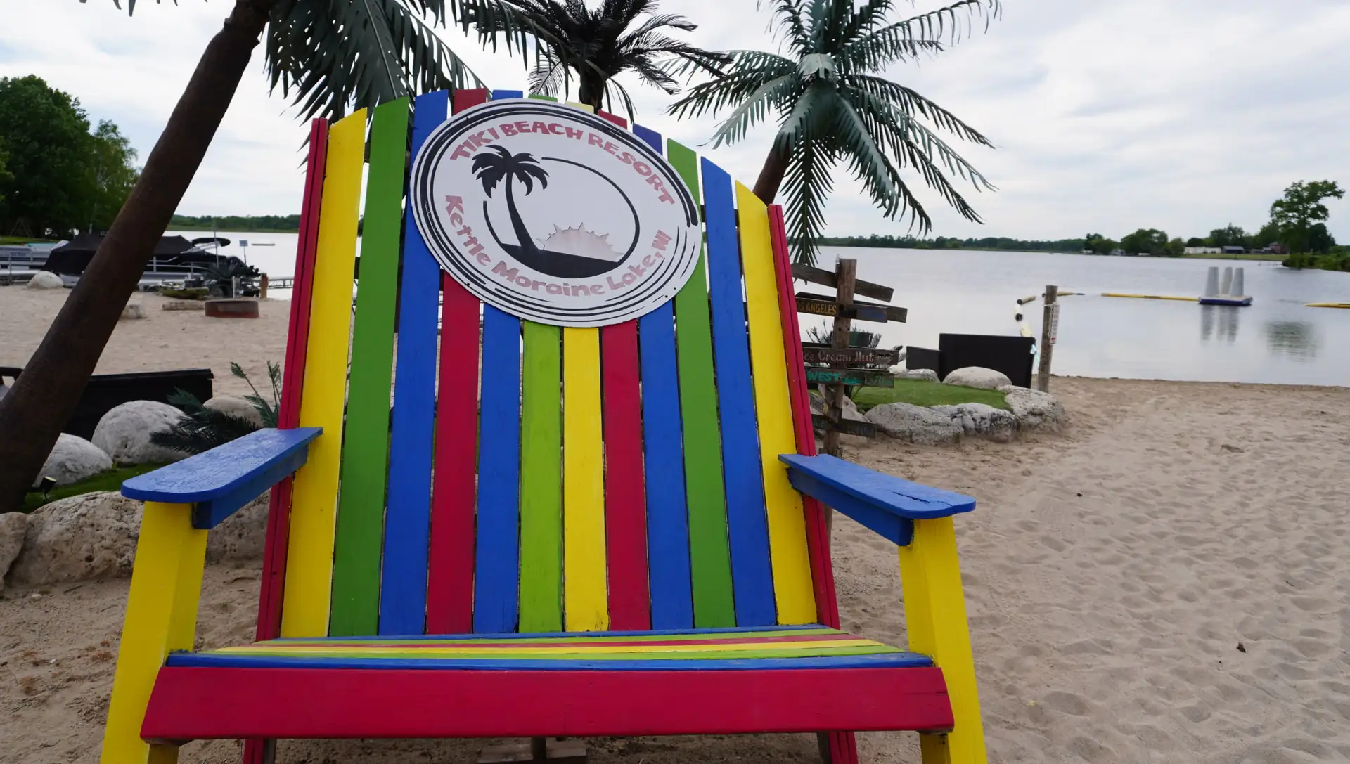 The giant rainbow Adirondack photo-op chair stamped with the Tiki Beach Resort logo