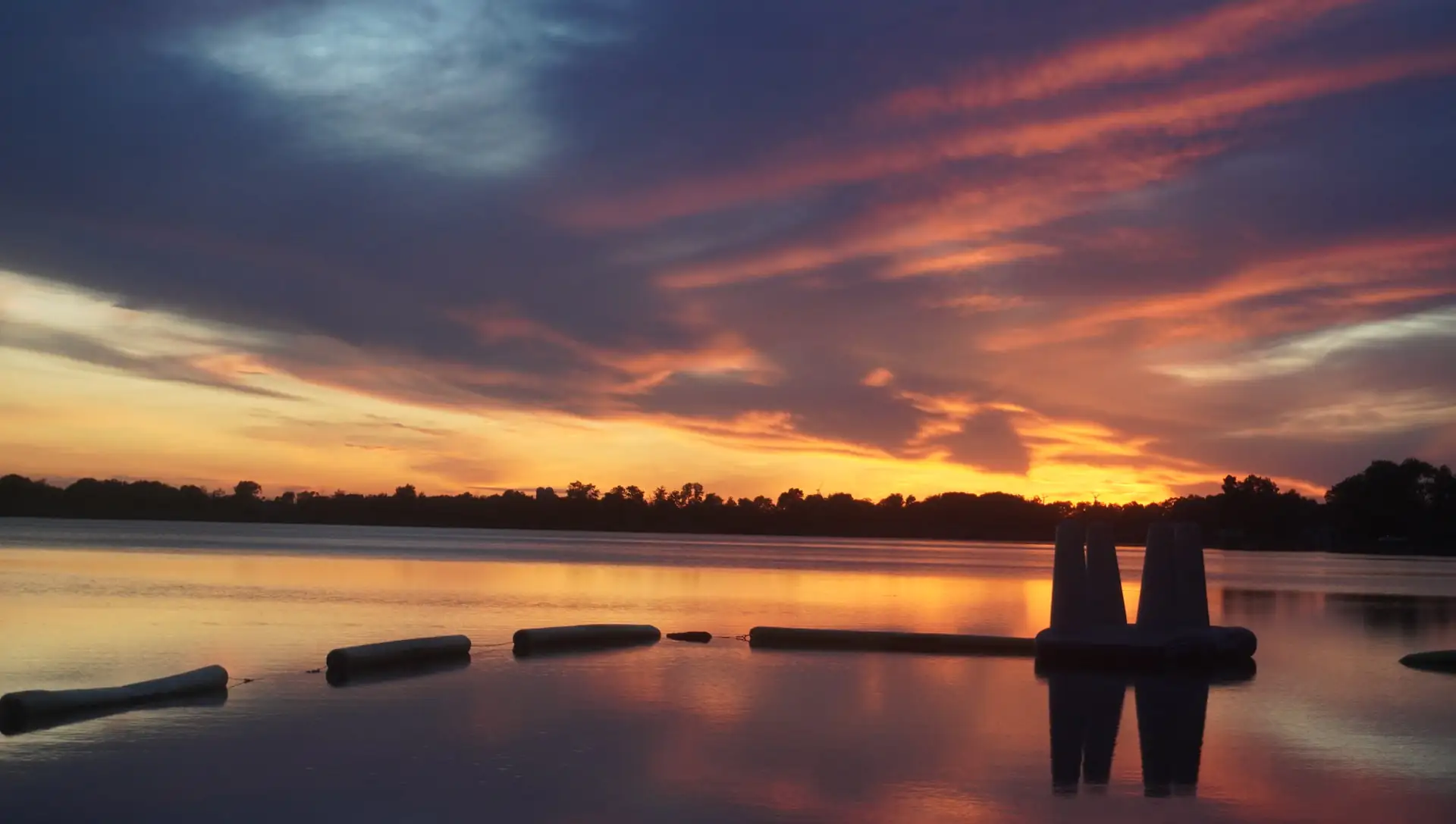 A fiery orange-and-purple sunset over Kettle Moraine Lake