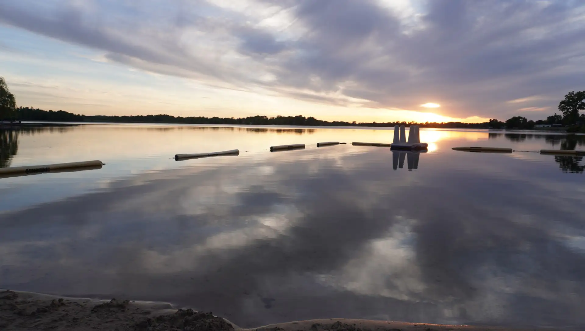 Pastel sunset reflected on the calm lake