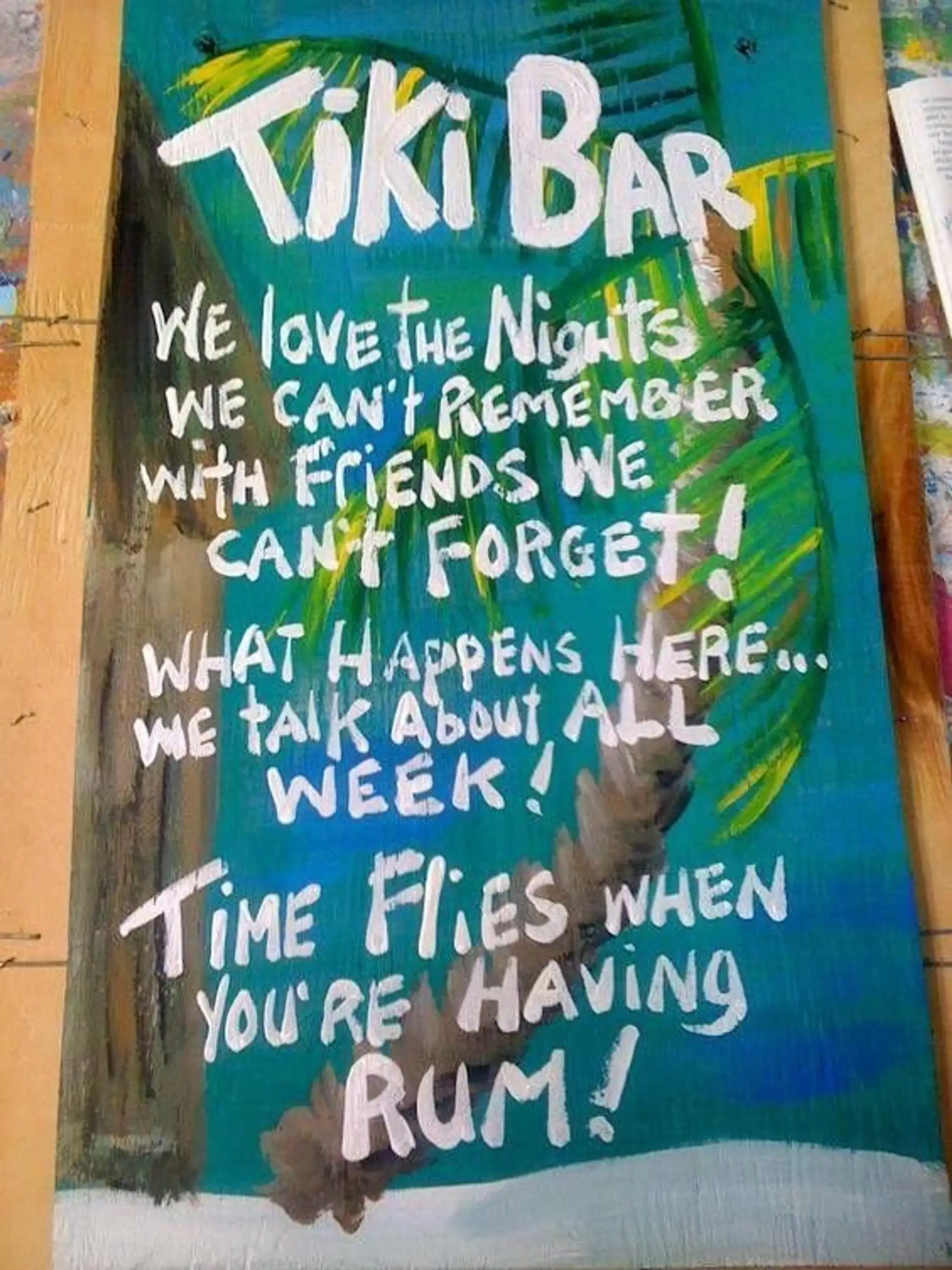 Hand-painted Tiki Bar sign: time flies when you're having rum